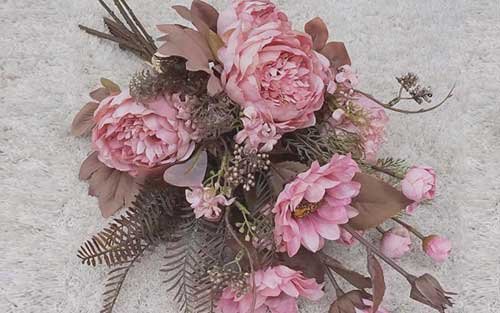 This is a pink dried flowers bouquet with artificial flower material Category